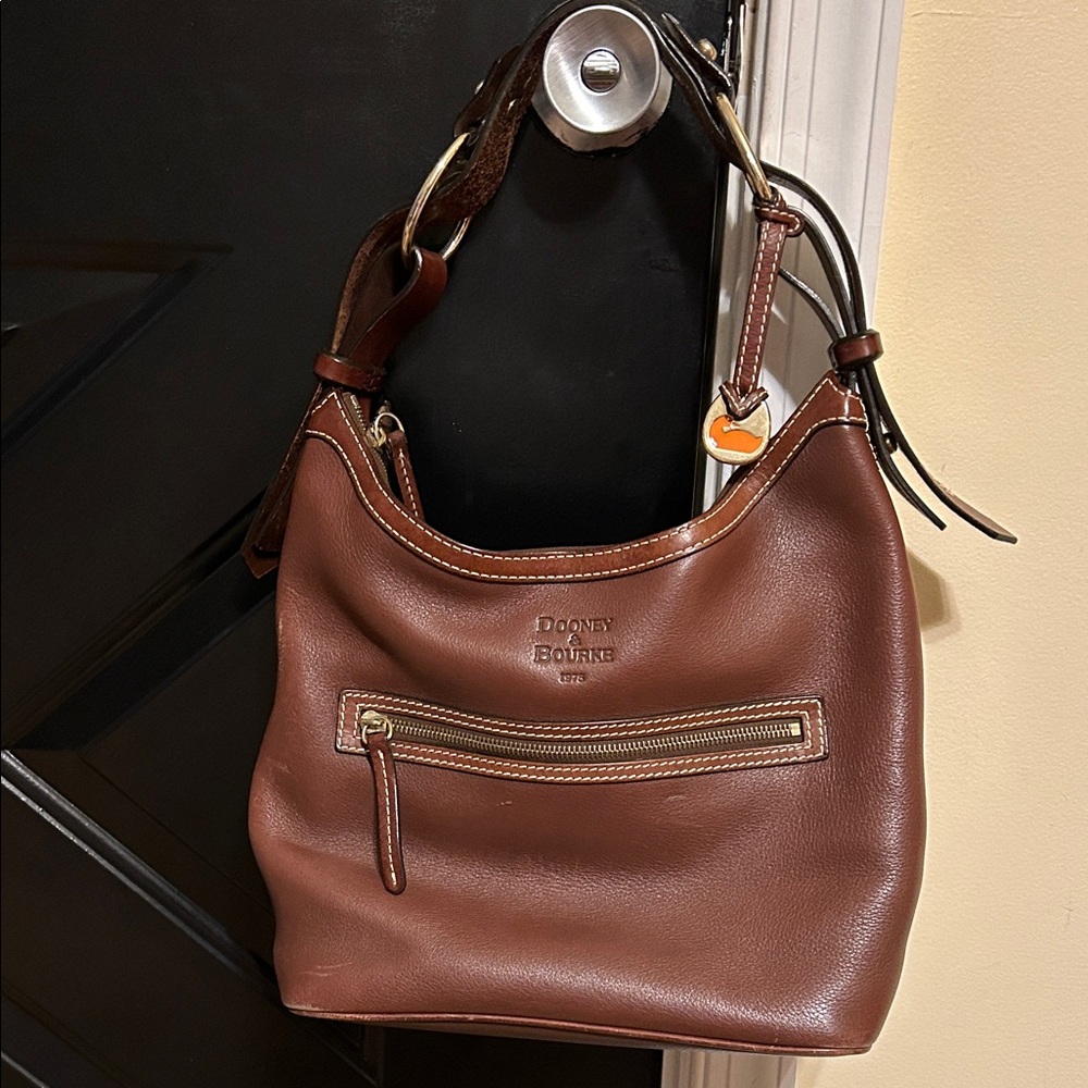 Dooney & Bourne Medium Leather Purse is in great condition with minor wear noted